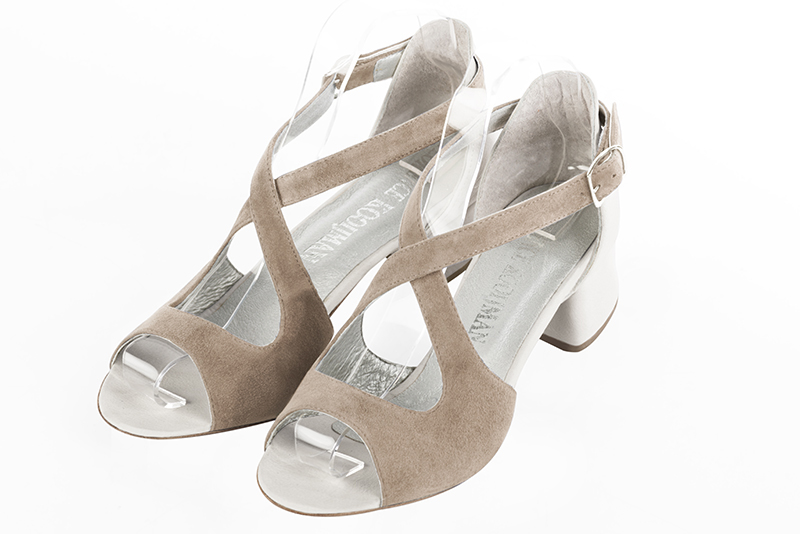 Tan beige and off white women's closed back sandals, with crossed straps. Round toe. Low flare heels. Front view - Florence KOOIJMAN